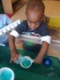 2-year-old-playing_at_water_table_cadence_academy_preschool_sherwood_or-338x450
