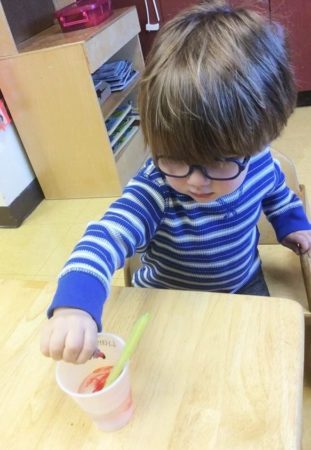 2-year-old_boy_color_mixing_activity_carolina_kids_child_development_center_fort_mill_sc-311x450