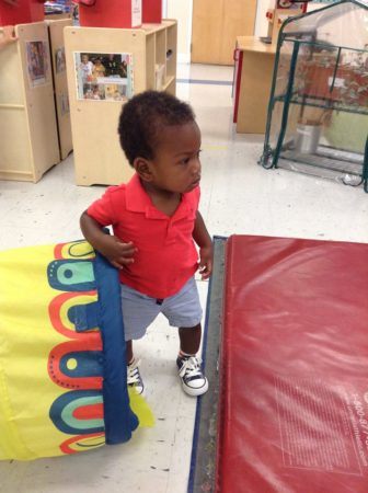2-year-old_boy_coming_out_tunnel_cadence_academy_ballantyne_charlotte_nc-336x450