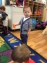 2-year-old_boy_holding_dinosaur_cadence_academy_preschool_east_greenwich_ri-338x450