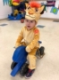 2-year-old_boy_in_lion_king_costume_on_tricycle_learning_edge_childcare_and_preschool_oak_creek_wi-328x450
