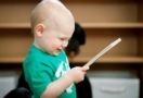 2-year-old_boy_looking_at_book_winwood_childrens_center_brambleton_va-658x450