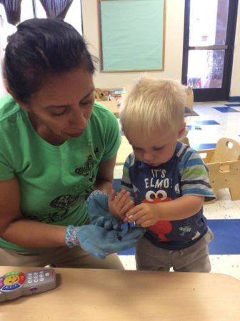 2-year-old_boy_looking_at_worm_at_phoenix_childrens_academy_private_preschool_chandler_heights-336x450