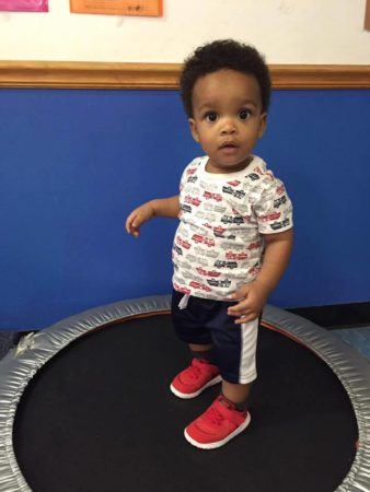 2-year-old_boy_on_trampoline_at_cadence_academy_preschool_surfside_myrtle_beach_sc-338x450