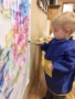 2-year-old_boy_painting_mural_rogys_learning_place_big_hollow_peoria_il-338x450