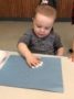 2-year-old_boy_playing_with_white_paint_cadence_academy_preschool_ashworth_west_des_moines_ia-336x450