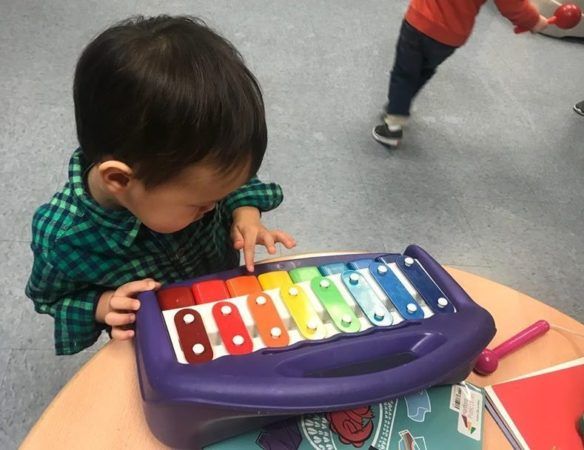 2-year-old_boy_playing_xylophone_jonis_child_care_and_preschool_hartford_ct-584x450