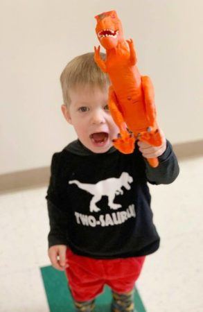 2-year-old_boy_with_t-rex_cadence_academy_preschool_steele_creek_charlotte_nc-293x450