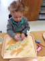 2-year-old_girl_coloring_with_chalk-next_generation_childrens_centers_natick_ma-336x450