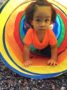 2-year-old_girl_crawling_through_rainbow_tube_cadence_academy_preschool_ashworth_west_des_moines_ia-336x450