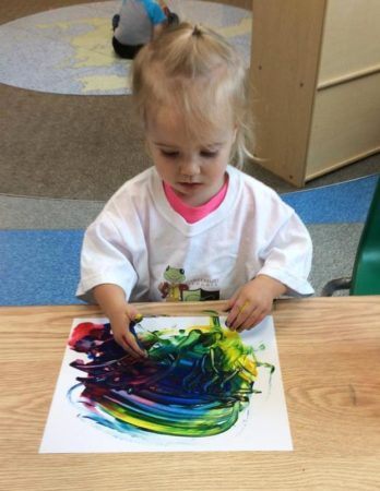 2-year-old_girl_doing_fingerpaint_canterbury_academy_at_prairie_ridge_olathe_ks-348x450