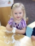 2-year-old_girl_doing_playdough_activity_carolina_kids_child_development_center_fort_mill_sc-343x450