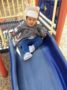 2-year-old_girl_going_down_slide_cadence_academy_preschool_mallard_charlotte_nc-336x450