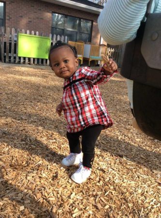 2-year-old_girl_on_playground_at_cadence_academy_preschool_summerville_sc-333x450