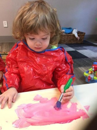 2-year-old_girl_painting_cadence_academy_preschool_cooper_point_olympia_wa-336x450