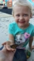2-year-old_holding_butterfly_rogys_learning_place_morton_il-253x450