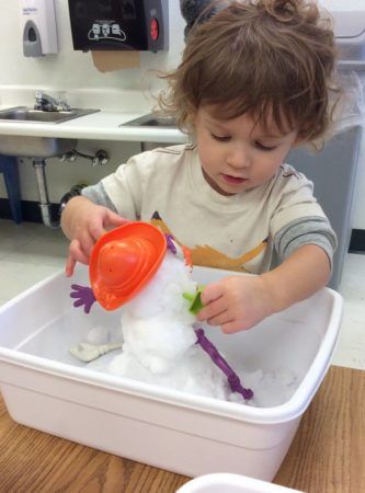 2-year-old_making_small_snowman_in_tub-333x450