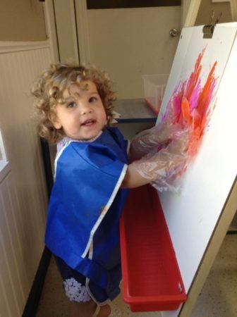 2-year-old_painting_with_hands_cadence_academy_preschool_tumwater_wa-336x450