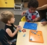 2-year-old_playing_with_playdough_at_cadence_academy_preschool_grand_prairie_tx-463x450