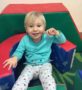 2-year-old_relaxing_on_foam_pieces_cadence_academy_preschool_milwaukie_portland_or-408x450