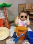 2-year-old_wearing_sunglasses_inside_cadence_academy_preschool_urbandale_ia-333x450