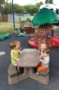 2-year-olds_eating_bomb_pops_on_playground_creative_expressions_learning_center_eureka_mo-293x450
