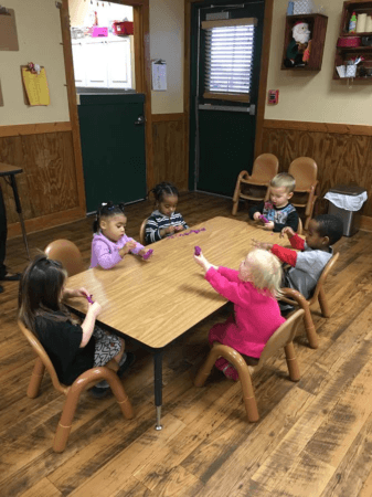2-year-olds_playing_with_playdough_at_bearfoot_lodge_private_school_sachse_tx-337x450