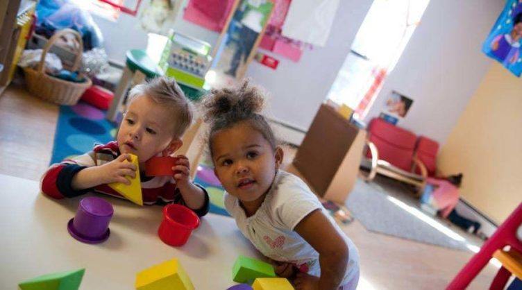 2-year-olds_playing_with_stackable_shapes_cadence_academy_preschool_norwood_ma-752x418