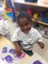 Child doing crafts indoors