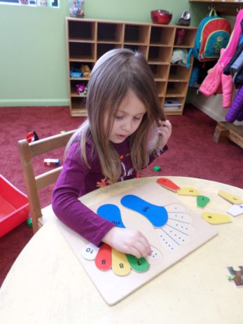 Child doing crafts indoors
