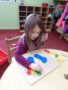 Child doing crafts indoors