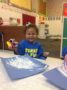 Child doing crafts indoors