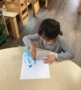 boy with blue paint making art at cadence academy preschool and daycare in dupont washington