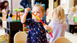 Child playing with building toy during hands-on learning activity at Craycroft