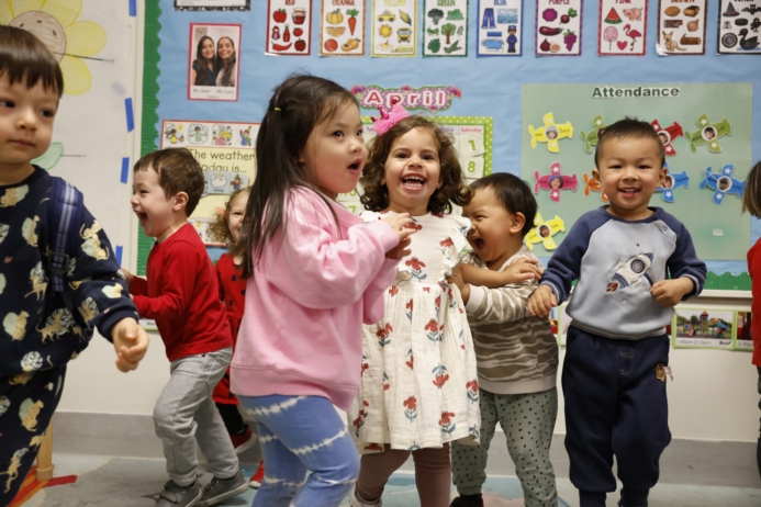 children participating in classroom dance movement activity in craycroft