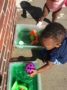 child learning outside with toys at cadence academy preschool and daycare raintree in huntersville north carolina