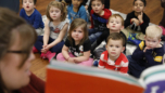 Students participating in a classroom group learning activity at Craycroft