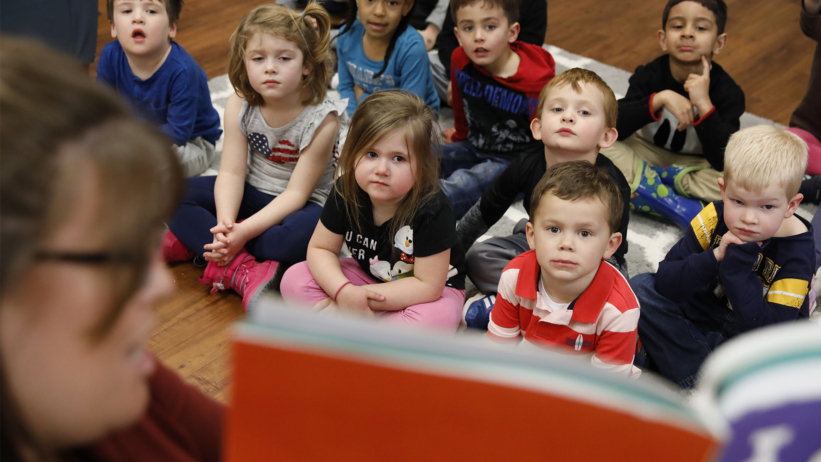 Students participating in a classroom group learning activity at Craycroft