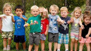 preschool students enjoying an outdoor group activity at Craycroft