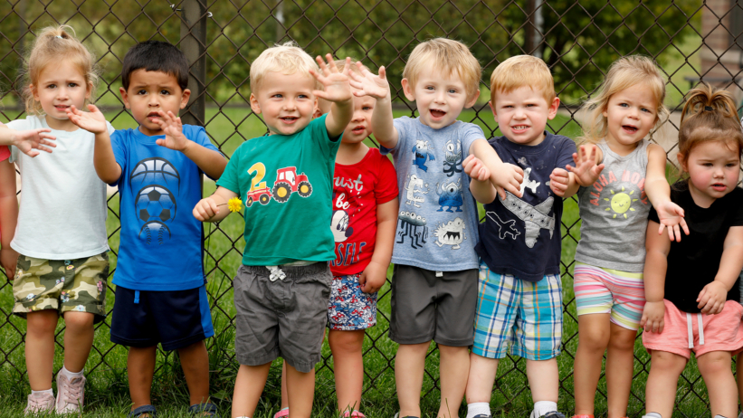 preschool students enjoying an outdoor group activity at Craycroft
