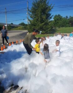 children playing in foam