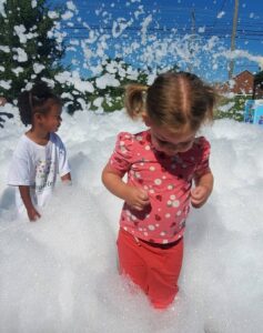 children playing in foam