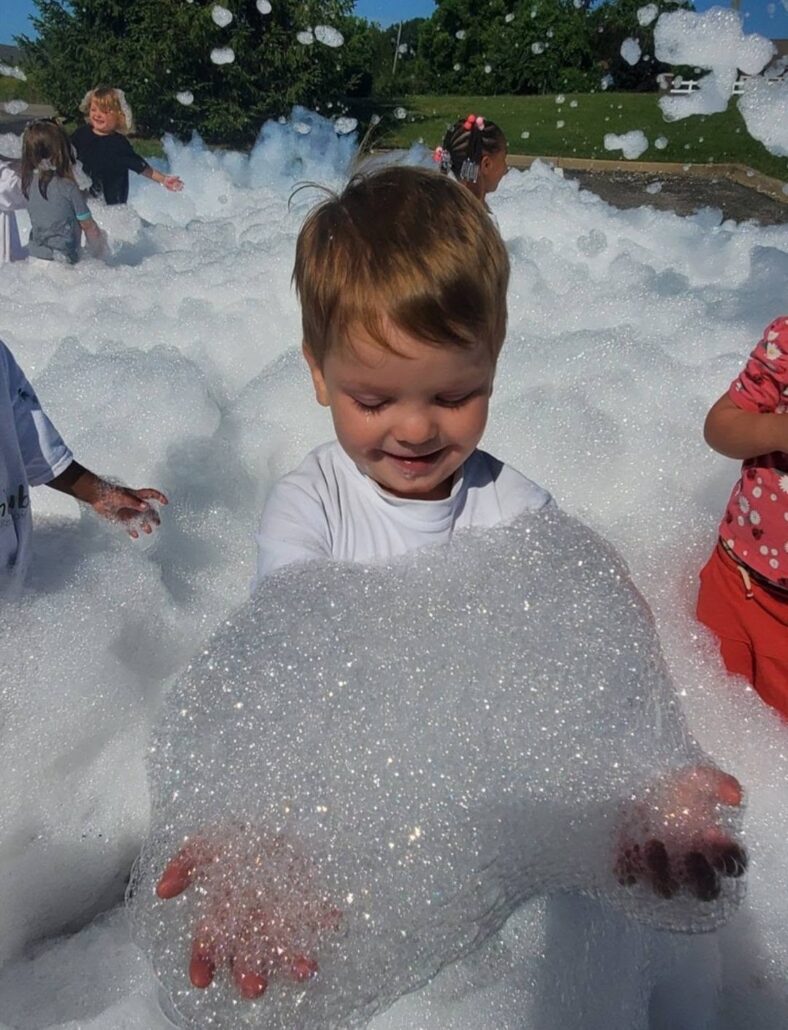 children playing in foam