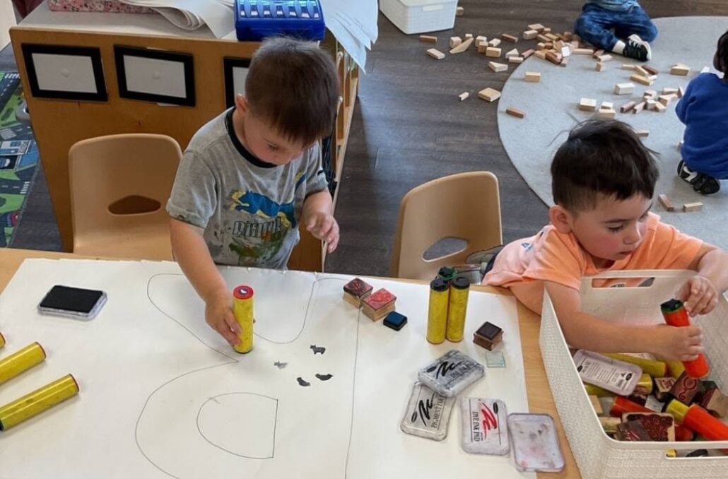 children using dot painters