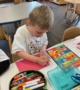 children practicing drawing