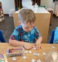 child playing with puzzle