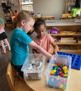 children playing in toy bucket