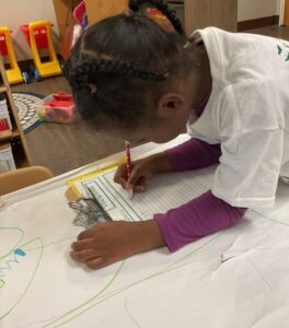 child learning how to write