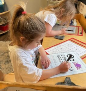 Girl practicing writing letters practice Louisville