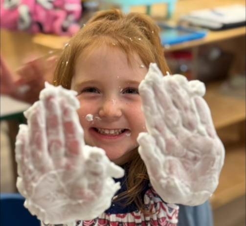 Child holding up dirty hands at Crestwood